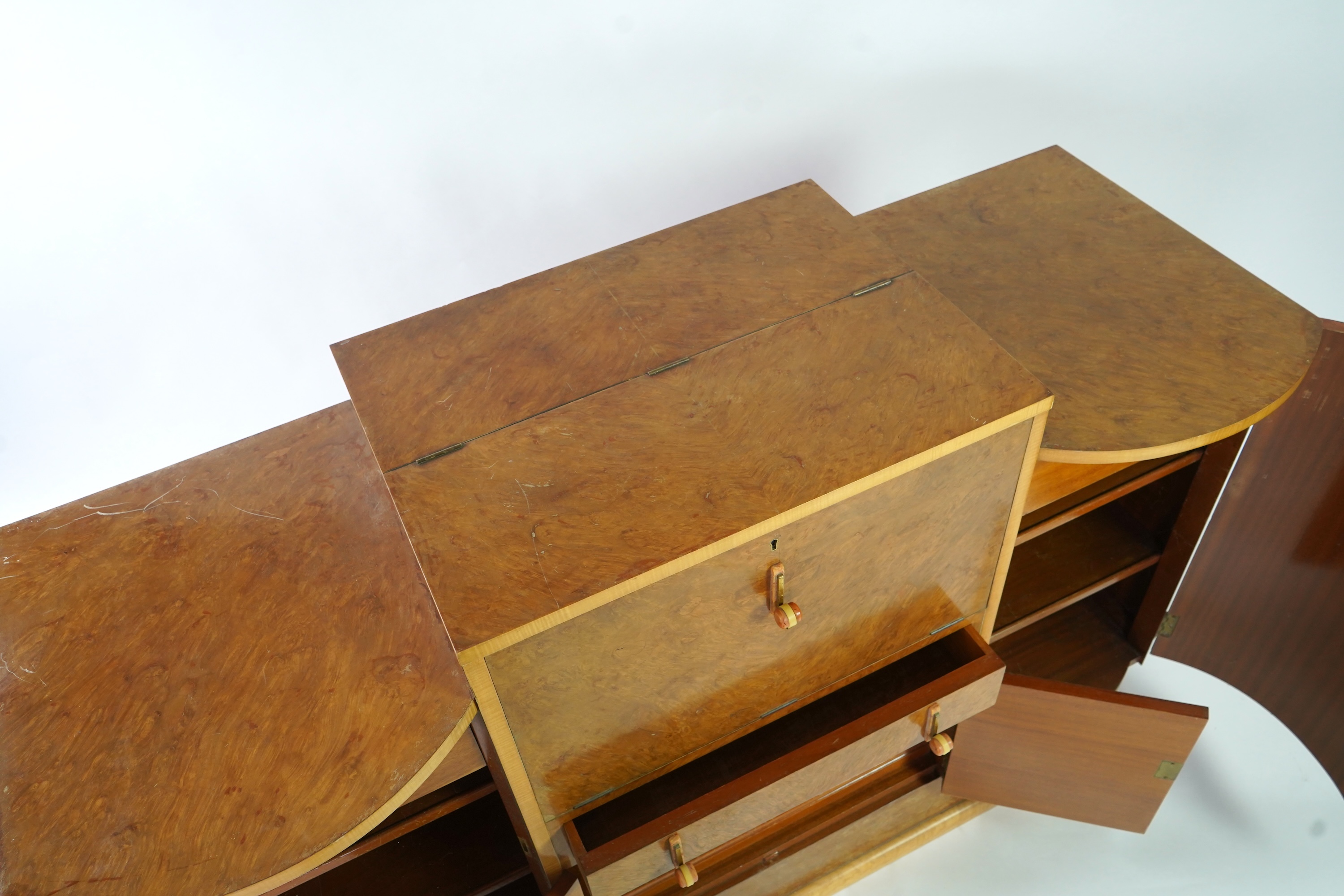 Attributed to Harry and Lou Epstein: An Art Deco burr walnut dining suite